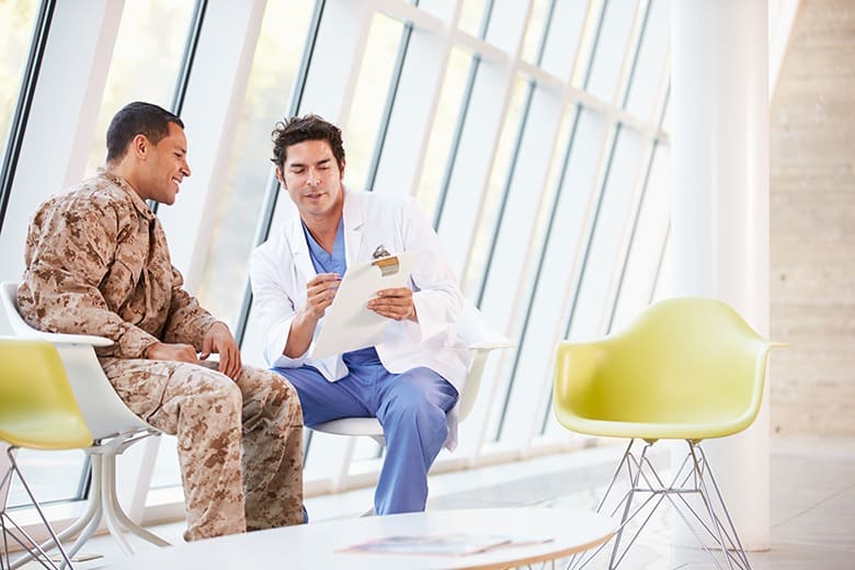 doctor explaining paper to soldier