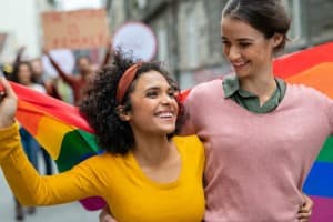 couple in march with pride flag