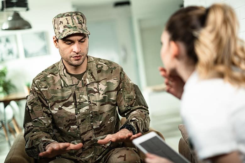 solider talking to woman