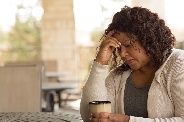 woman drinking coffee stressed